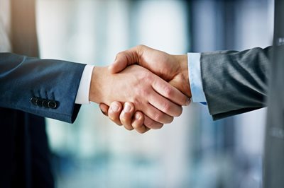 Email marketing professionals shake hands image